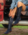 Old Gringo Boots Mayra Mid navy blue suede western boots with intricate embroidery worn by a woman in a truck