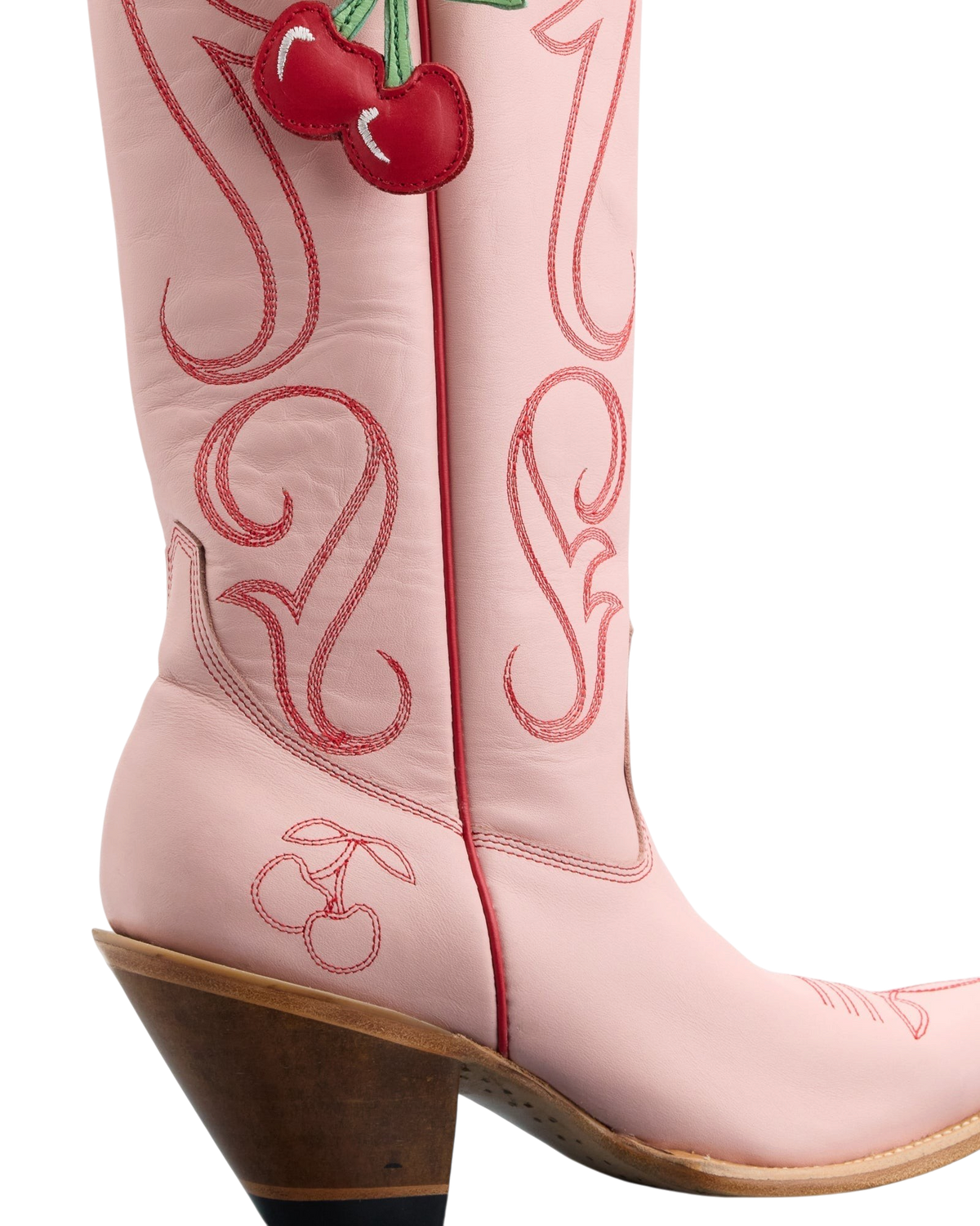 Old Gringo Boots pink cowhide western boots with red contrast stitching and a decorative cherry bauble charm.